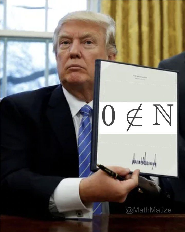 Donald Trump signing an executive order. The document he is holding reads "0 not in N".