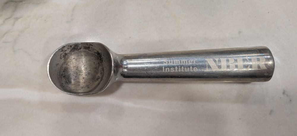 An ice cream scoop on a countertop, but not just any ice cream scoop - a Claudia Goldin ice cream scoop!