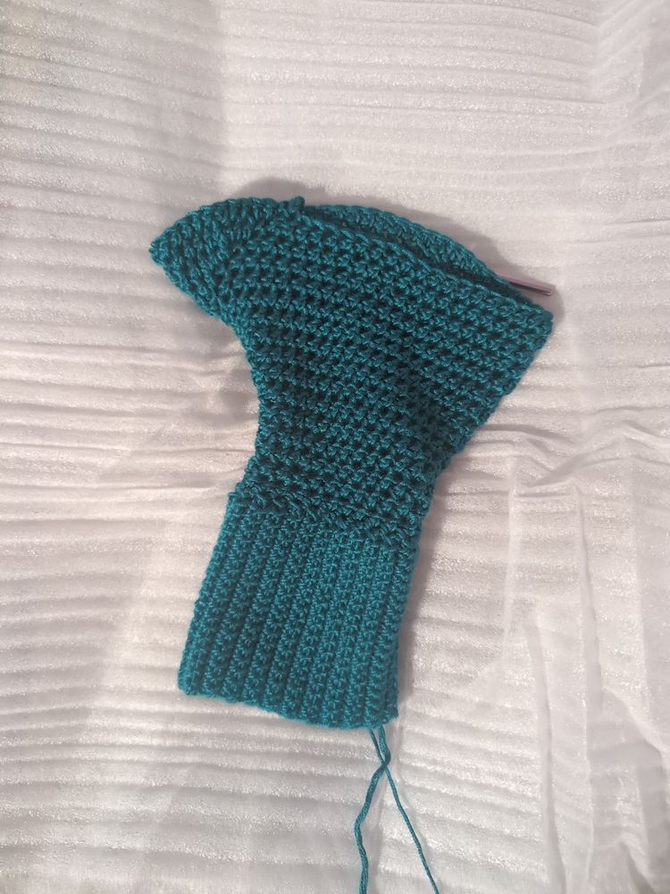 Turquoise sweater sleeve