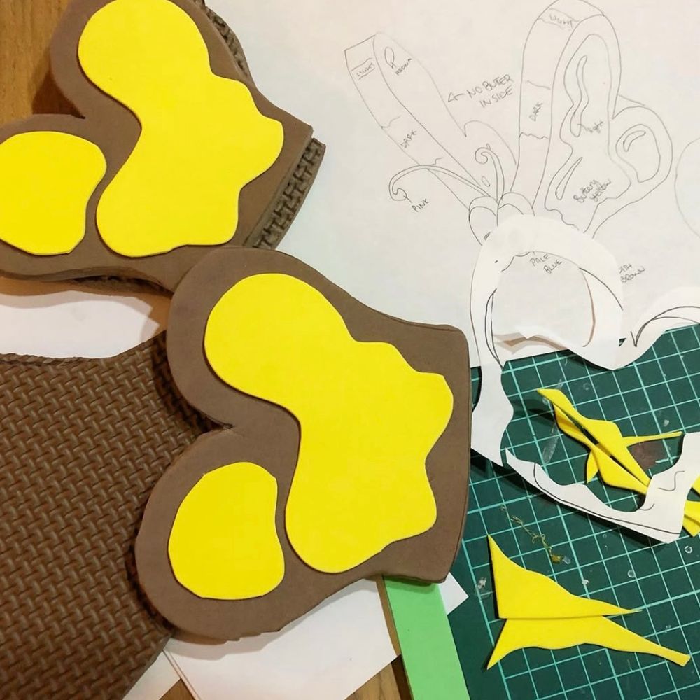 Wing pieces for a bread and butterfly prop replica made out of foam sheets along with a rough sketch of the final design