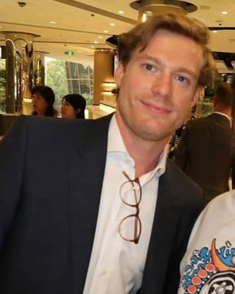 An old photo of Sam Reid with short hair.