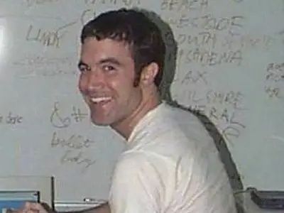 Tom from Myspace in that famous picture where he's in an undershirt in front of a white board.