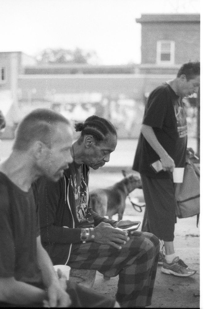 Three people gather to meet together in community. 