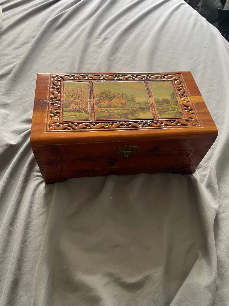 Wooden jewelry box with pastoral scene on the lid 