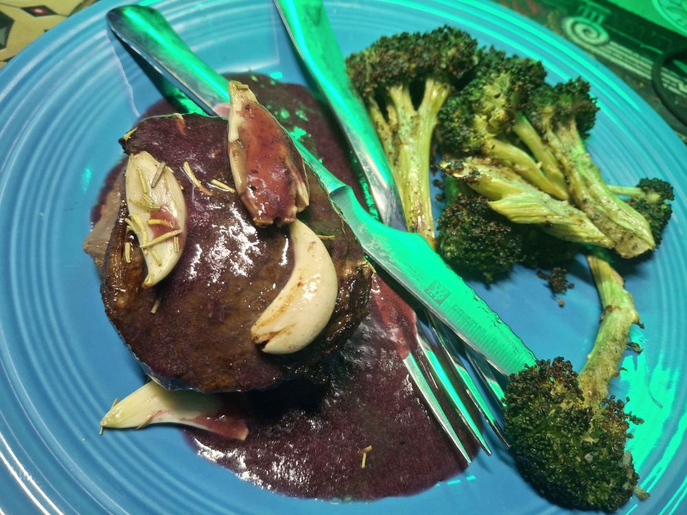 filet mignon in blueberry sauce; also roasted broccoli was there