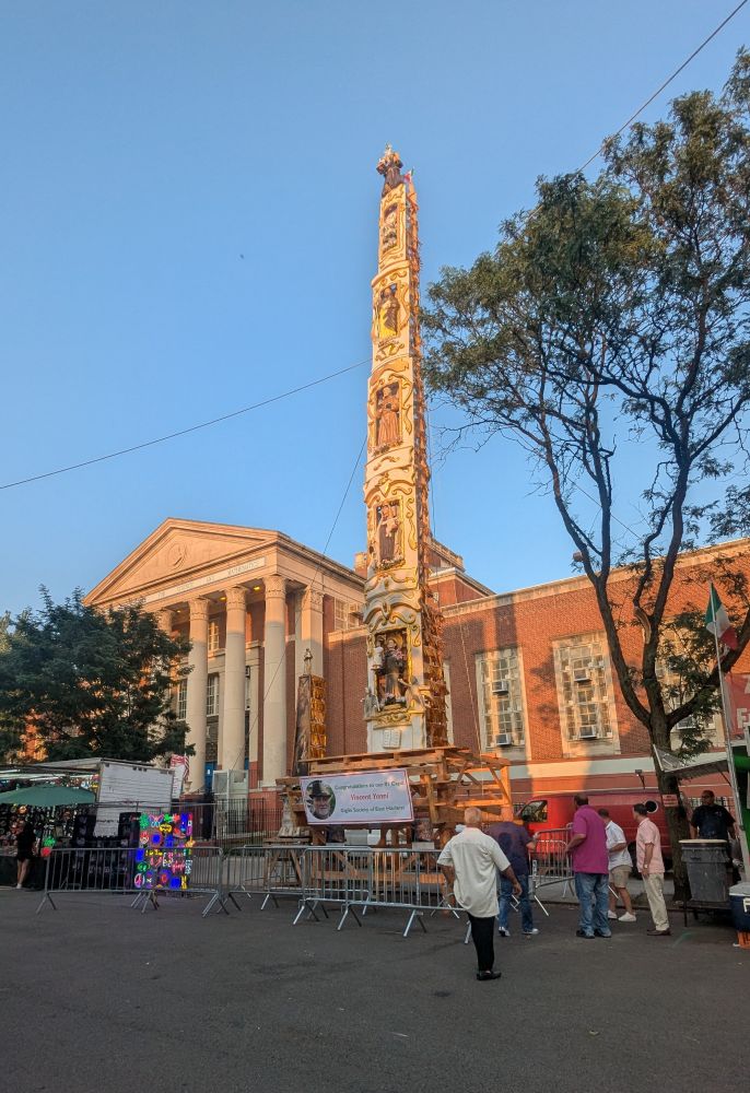Picture of the East Harlem Giglio, an 80-foot-tall, three-ton statue which is carried and danced through the streets of East Harlem by over 100 members of the EaSt Harlem Giglio Society.