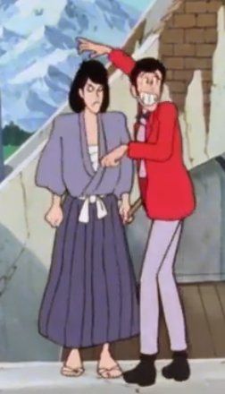Same scene but now Lupin looks at the camera sheepishly while Goemon has a J: face.
