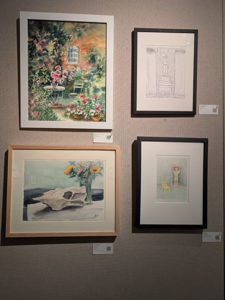 4 framed art pieces. The bottom left is a watercolor of a horse skull with a vase of flowers in the background
