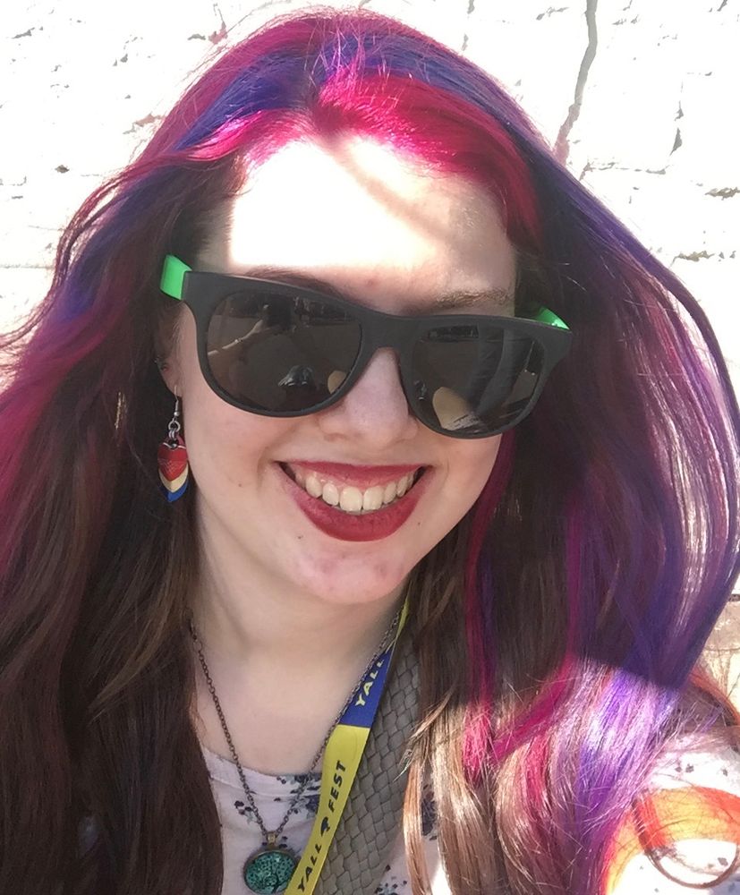 Photo of me (a white girl) as a teen with purple hair wearing sunglasses
