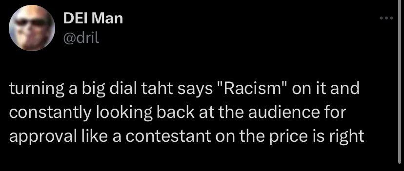 turning a big dial taht says "Racism" on it and constantly looking back at the audience for approval like a contestant on the price is right