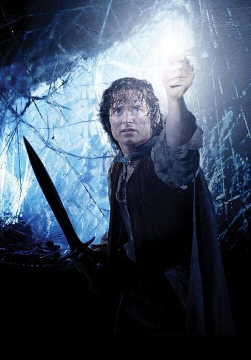 Image of Elijah Wood as Frodo in The Lord of the Rings: Return of the King. He's inside the dank and spiderweb-infested lair of the giant spider Shelob. 