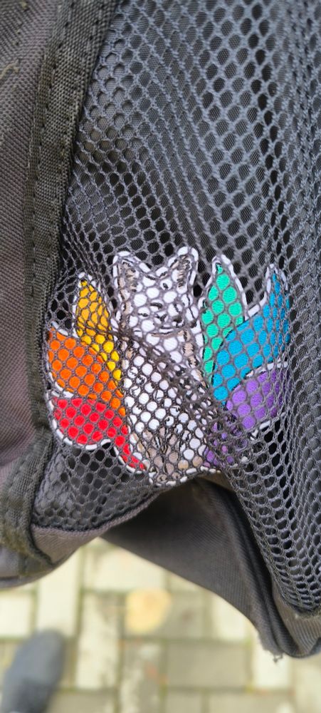 Kitsune/Fox with six tails. Tails have LGBTQIA+ colors