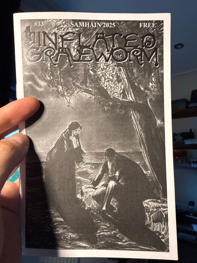 Magazine cover of an old lady standing over a bearded man in front of a tree.