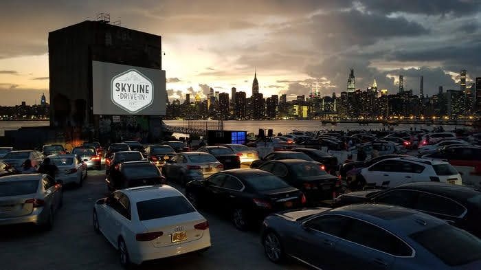 Skyline Drive-in theater in Greenpoint, Brooklyn, overlooking the Manhattan skyline at dusk. 