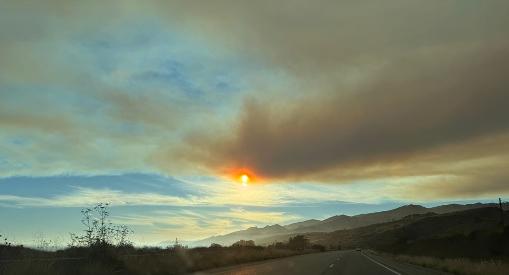 Smoke fills the air above the coast south of the Gifford fire 
