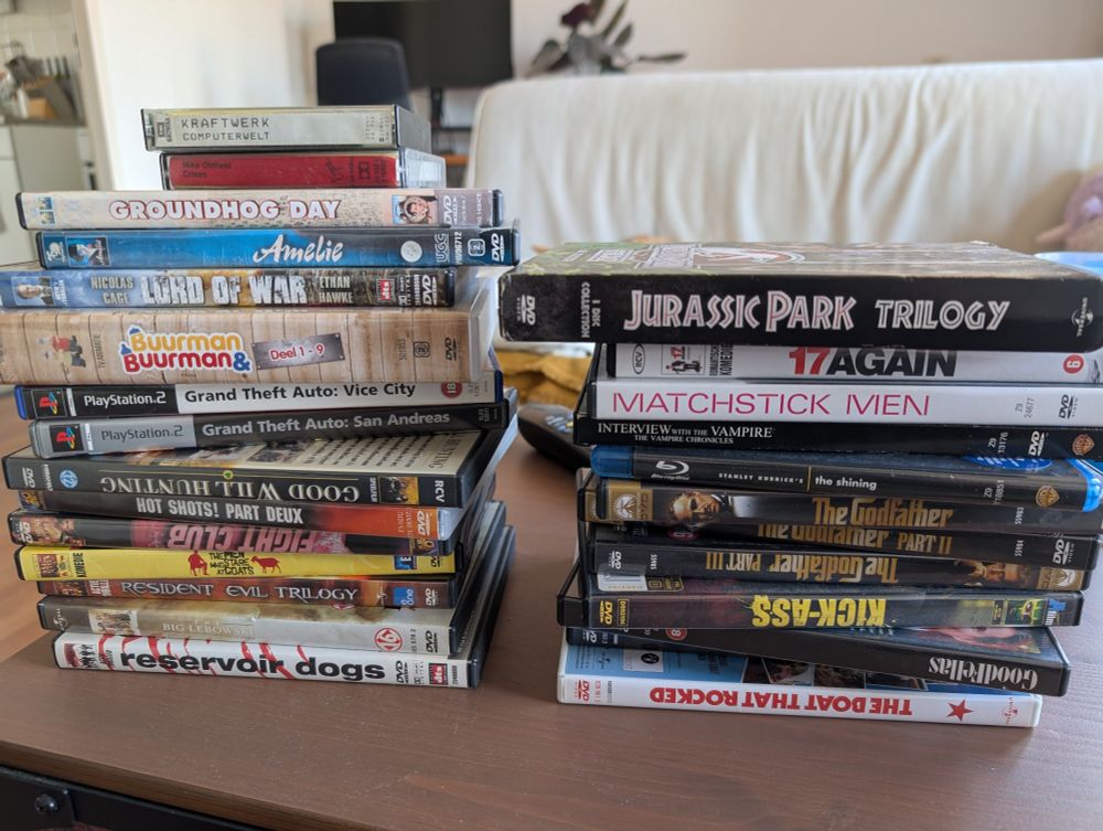 Two stacks of second hand DVDs