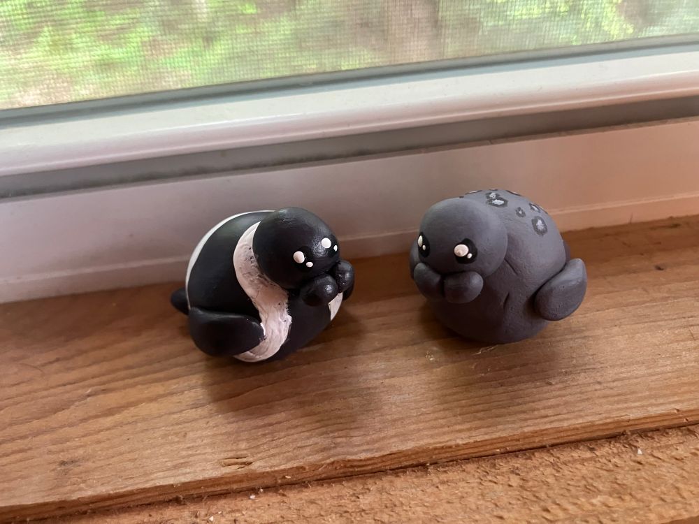 two clay seals in love