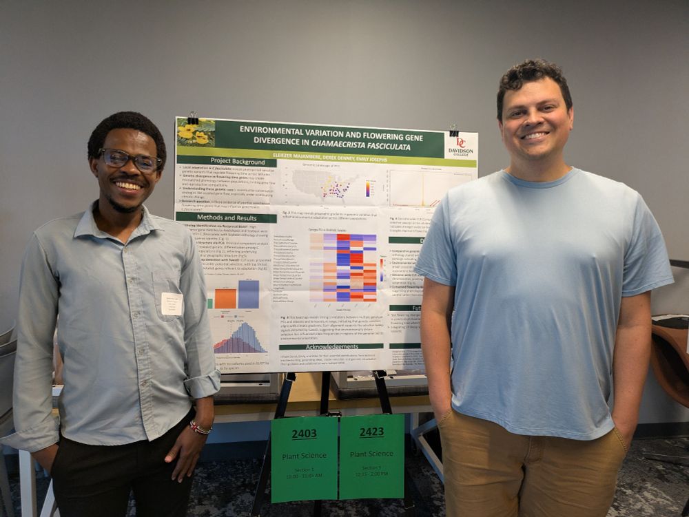 Eleiezer and Derek standing in front of a scientific poster 