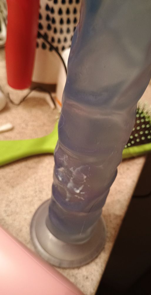 A blue dildo with cum on it.  