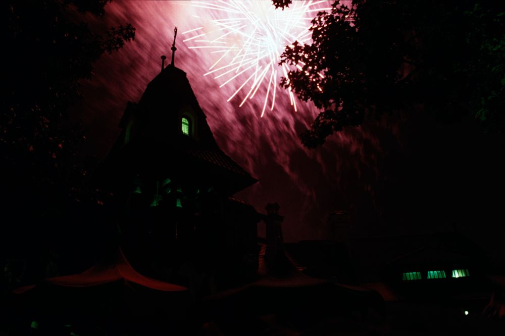 Fireworks of a steeple at Pinocchio Village Haus in Magic Kingdom