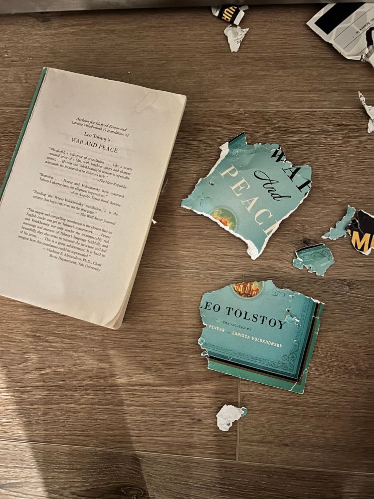 A copy of War and Peace with the cover torn to shreds.