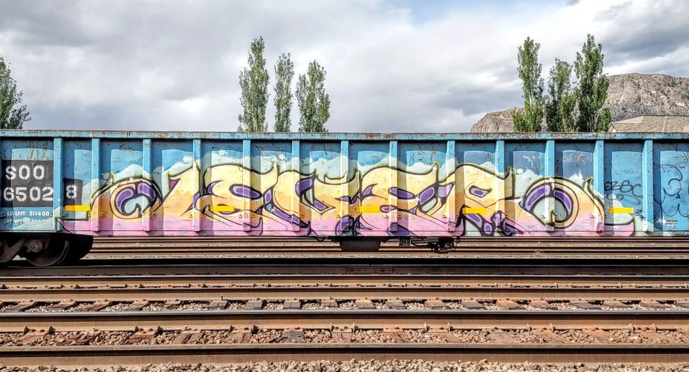 Train car with graffiti rolling through Kamloops BC Canada