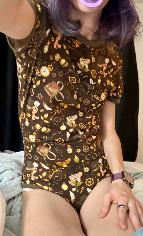 a fuller shot of a woman wearing a steampunk onesie