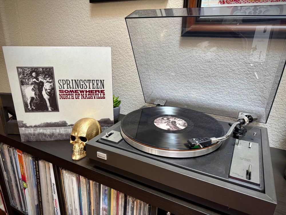 Somewhere North of Nashville from Tracks 2 by Bruce Springsteen playing on a record player.