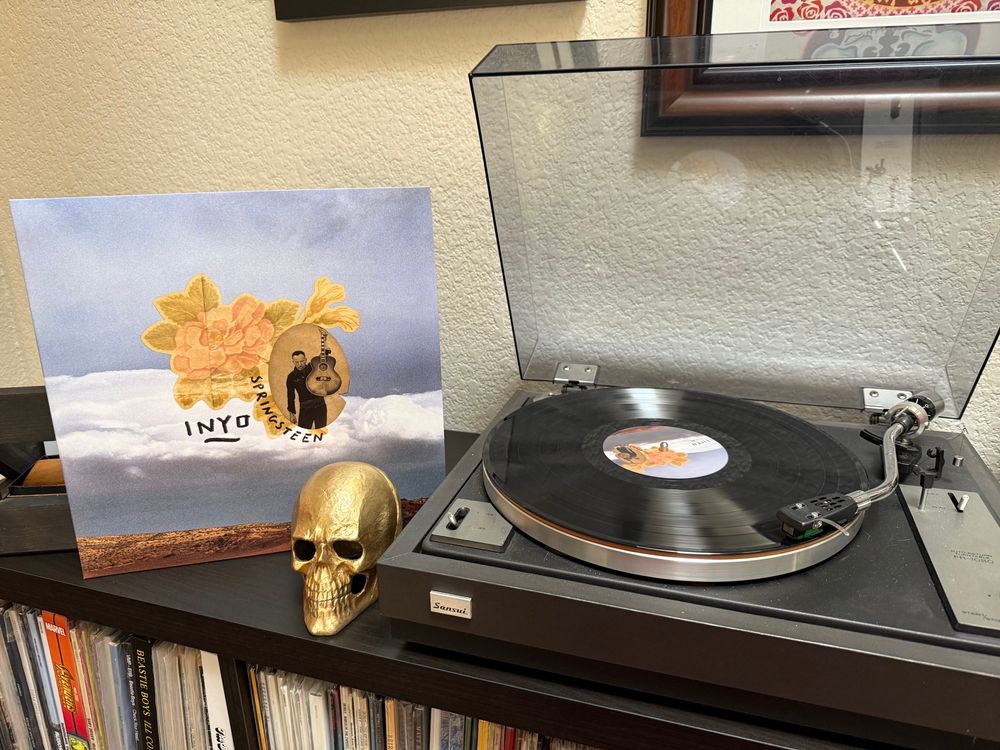Inyo from Tracks 2 by Bruce Springsteen playing on a record player.