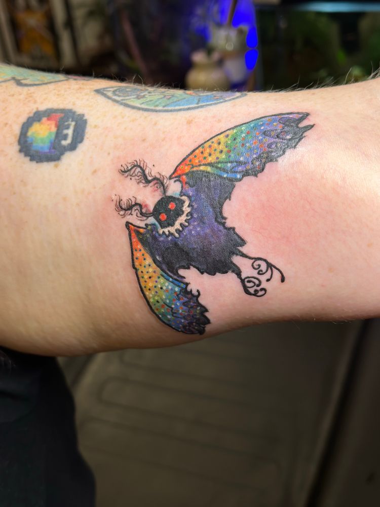Multicolored mothman tattoo bc every tattoo lux has is kinda gay bc why not