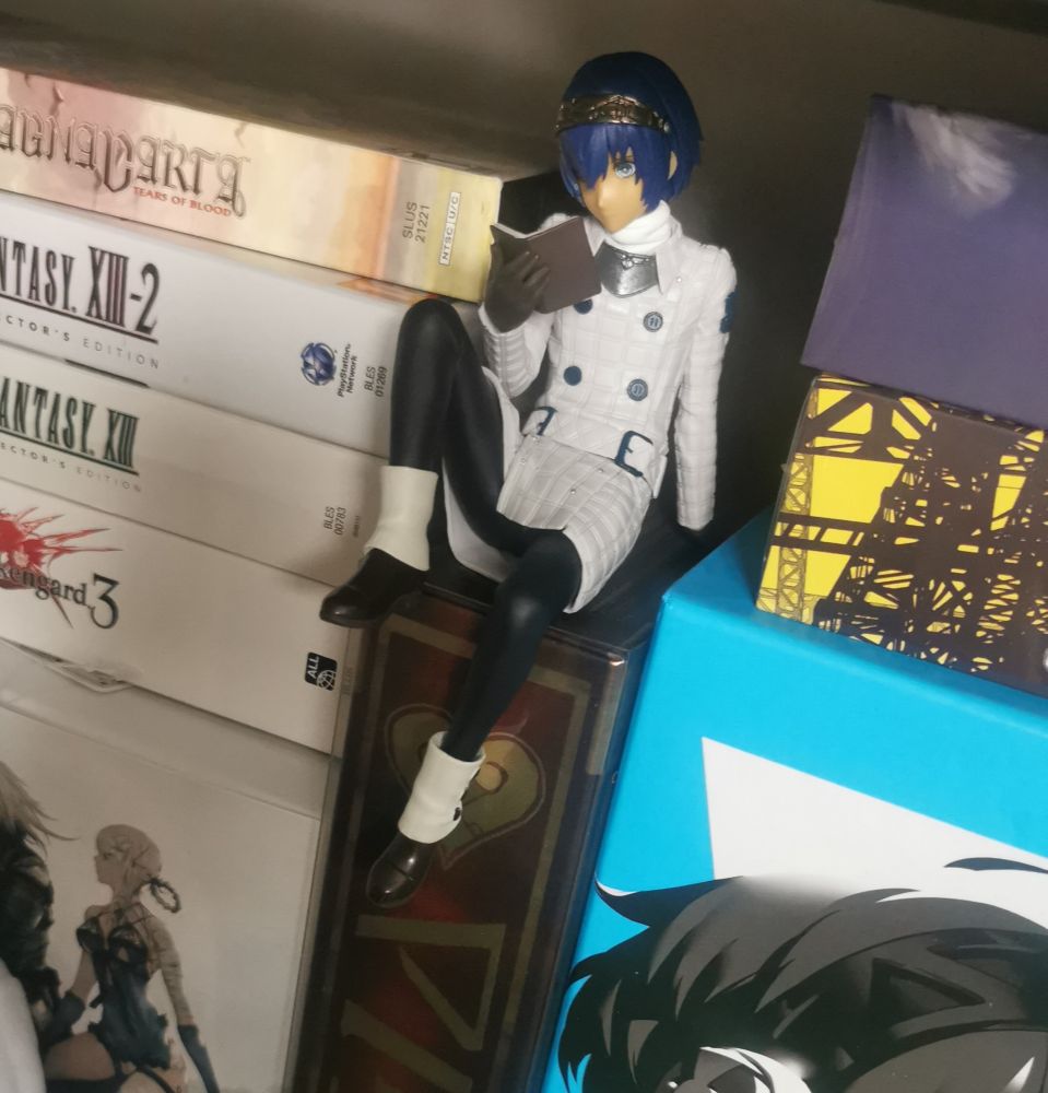 A figure of the protagonist Will from Metaphor Refantazio sitting on a box. 