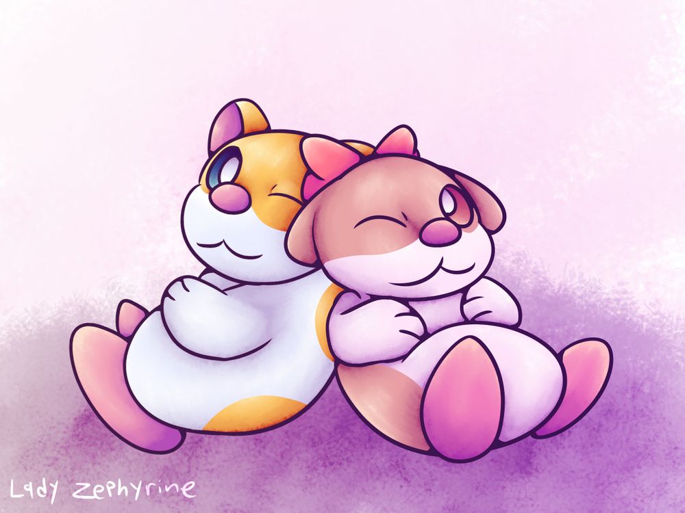 Two hamsters sitting together.