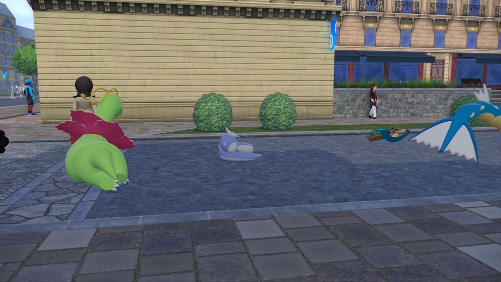 A large Dratini sleeping, a Meganium and a Honedge can be seen sleeping next to him.