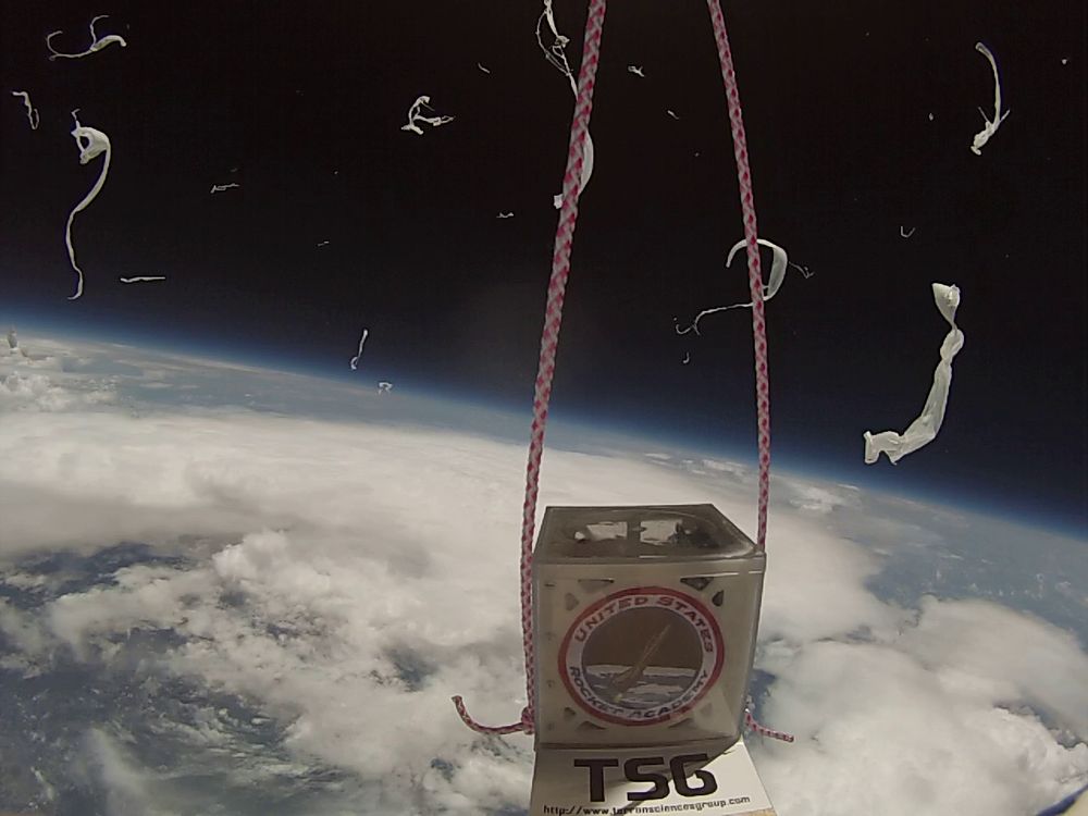 cubesat prototype imaged from 24km attached to a high altitude balloon. picture shows moment of balloon burst.