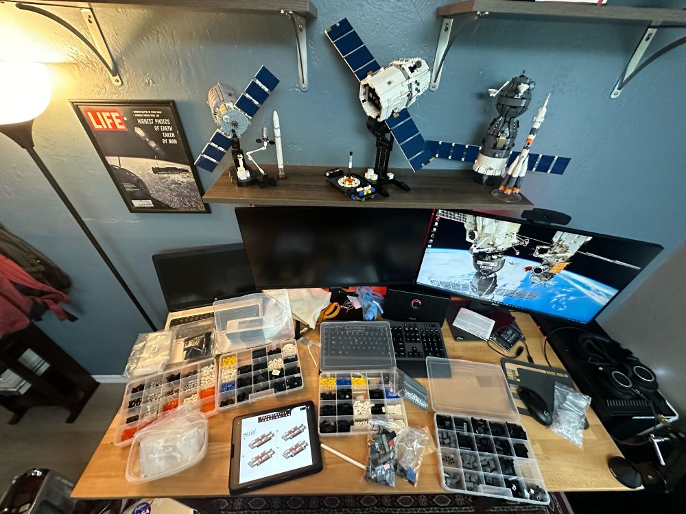 lego bricks on a desk with space themed models