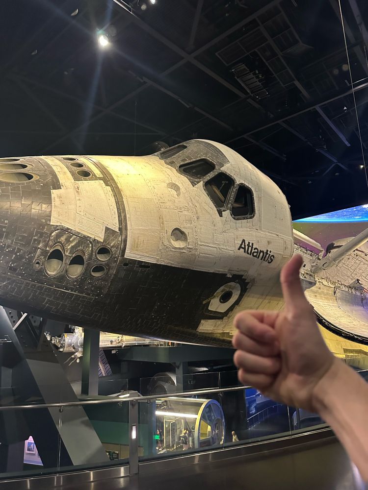 giving a thumbs up to space shuttle atlantis