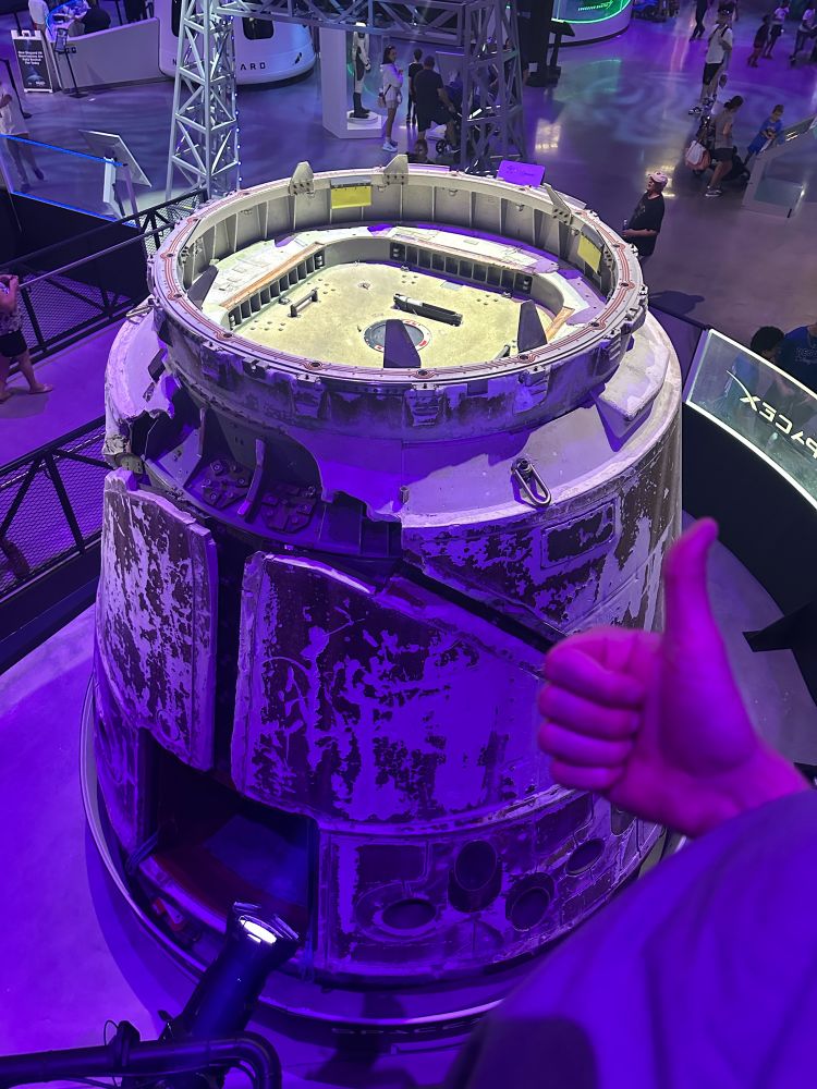 giving a thumbs up to dragon capsule C102