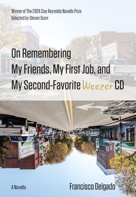 book cover featuring a regular image of a small town main street and that same image upside down.