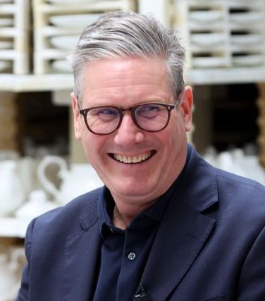 Kier Starmer, smiling erotically 