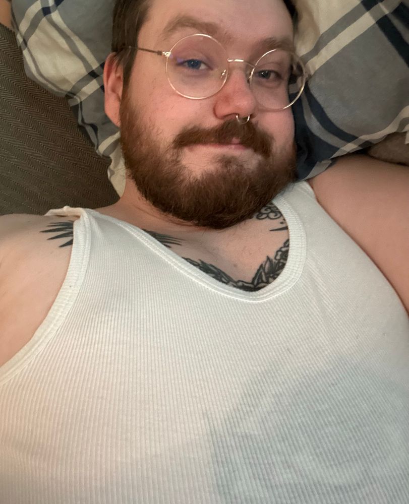 selfie of me wearing a white tank top