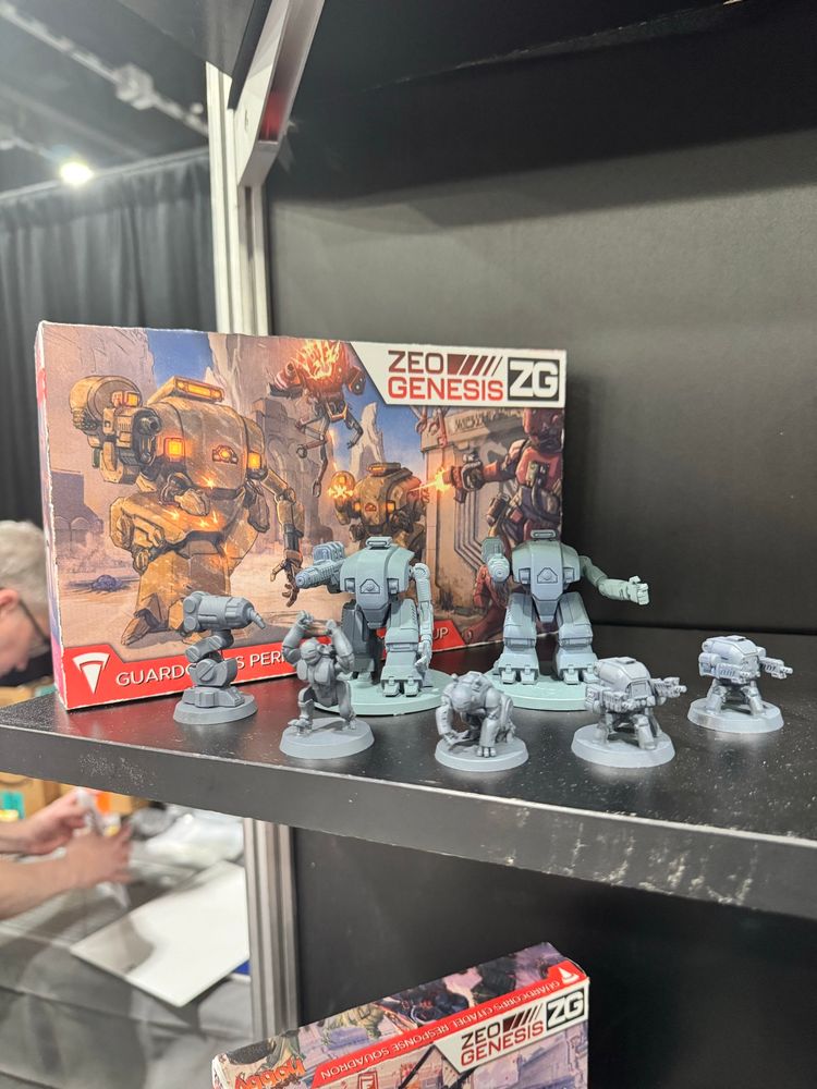 Two blocky armoured suits with robotic gorillas and auto turrets. 