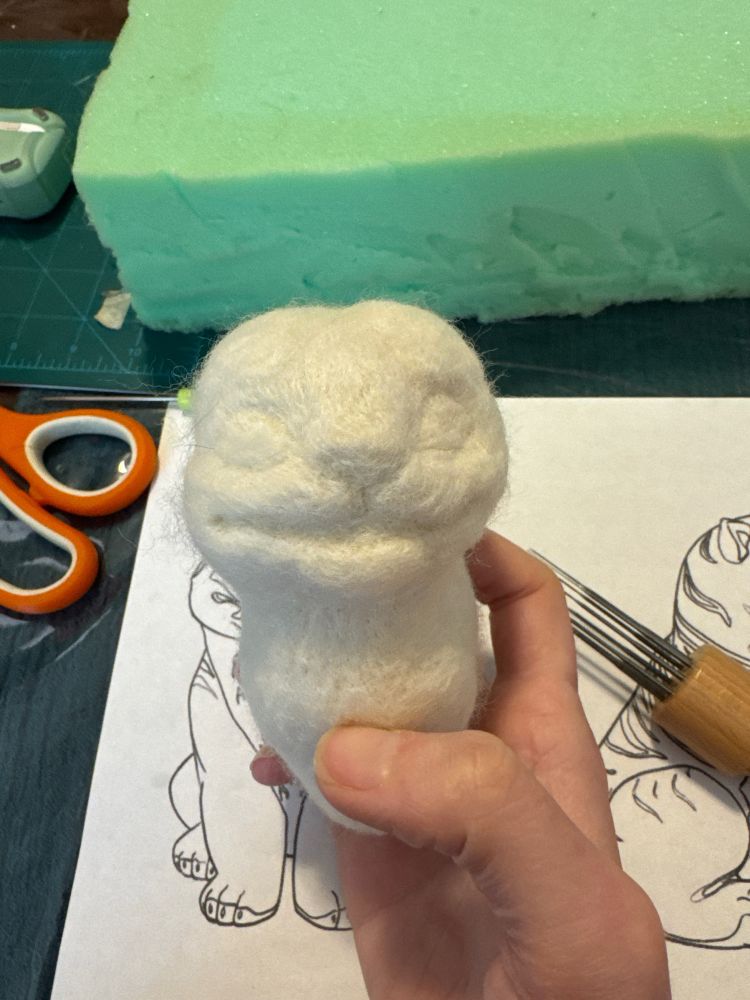 Front view of a needlefelt work in progress of the derpy tiger from K-pop demon hunters