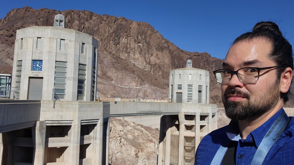 Myself pictured with the intake towers of the Hoover Dam.