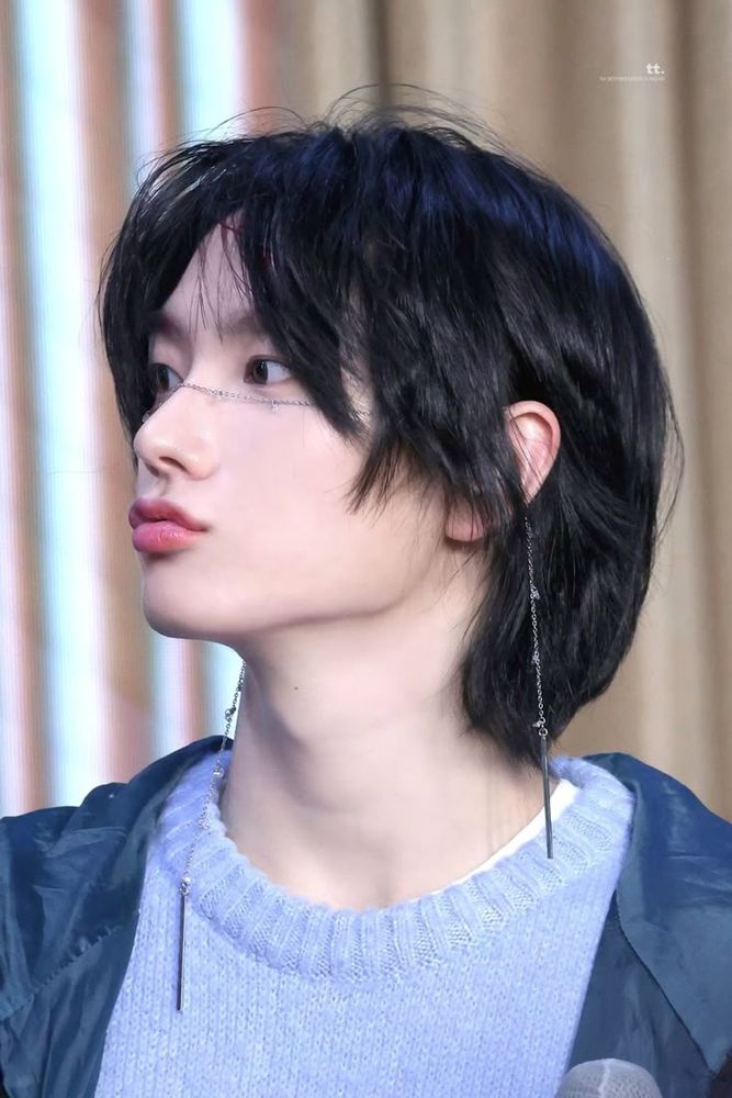 Park Sungho in a blue sweater under a windbreaker, looking to one side so that his lips and jawline show to best advantage. He is very pretty. 