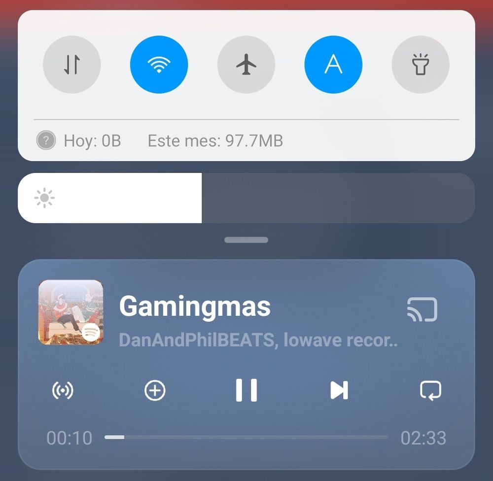 Screenshot from a phone widget screen the reproductor from Spotify reads "Gamingmas" a song from DanAndPhilBEATS, lowave records.