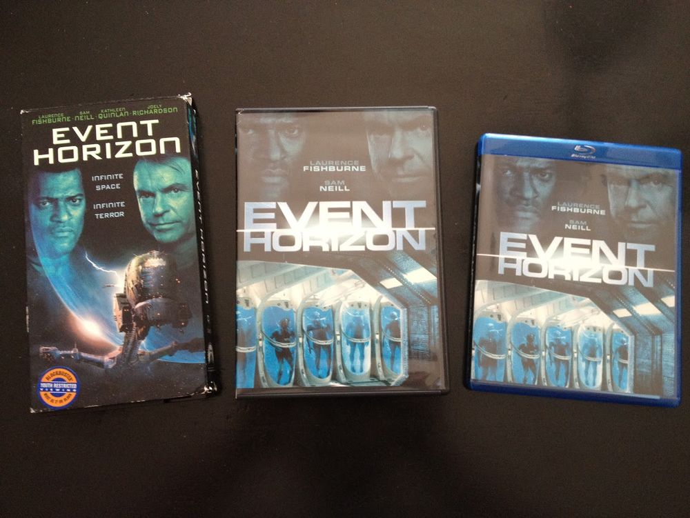 From left to right: a VHS copy of the film "Event Horizon," a DVD copy of the film "Event Horizon," and a Bluray copy of the film "Event Horizon"