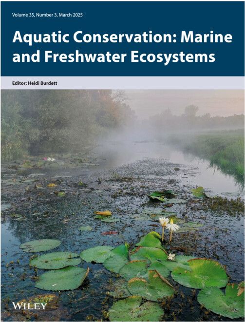 journal front cover with the Aquatic Conservation title header and an image below of a steaming river with flowering lilypads