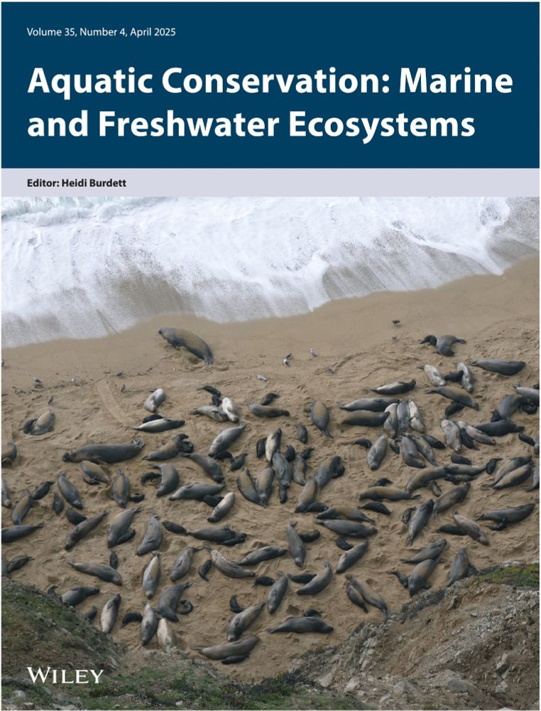 journal front cover with the aquatic conservation title and an aerial image below of elephant seals on a beach