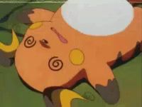 a cartoon character is laying on the ground with a white circle on its face .