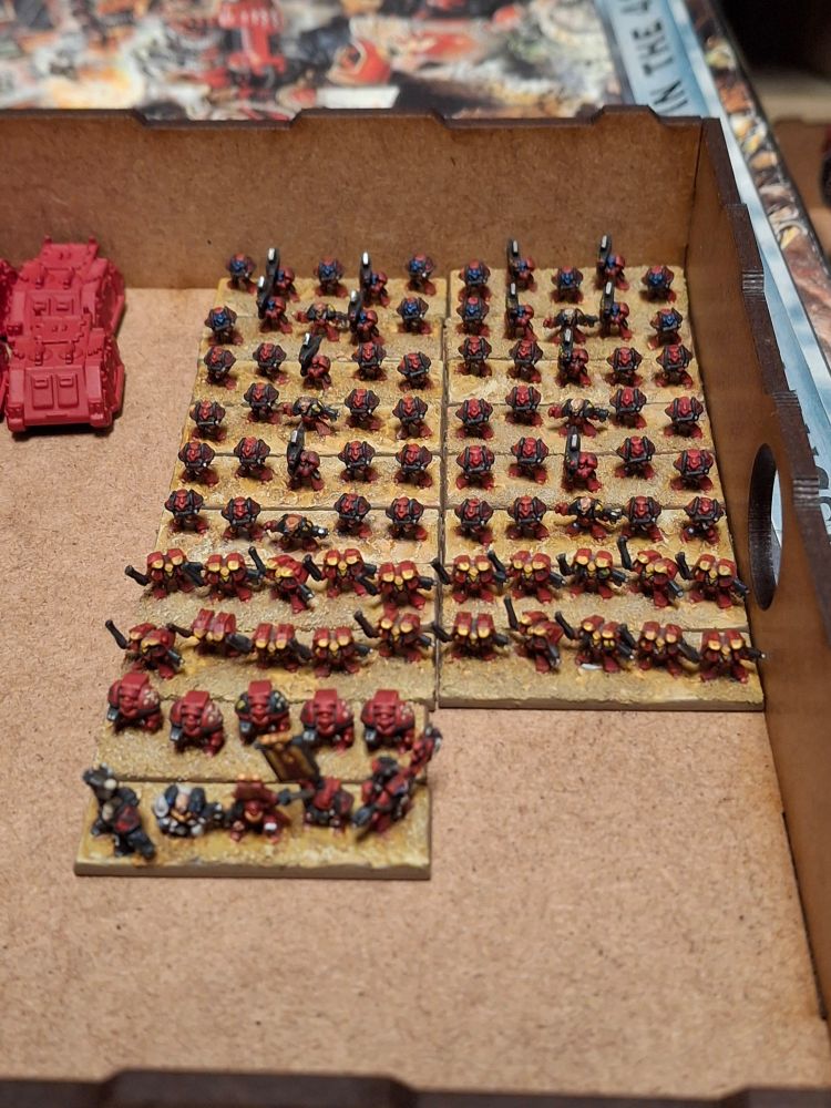 Almost a company's worth of Epic 40,000 Blood Angels on strip bases waiting to have their bases magnetised.